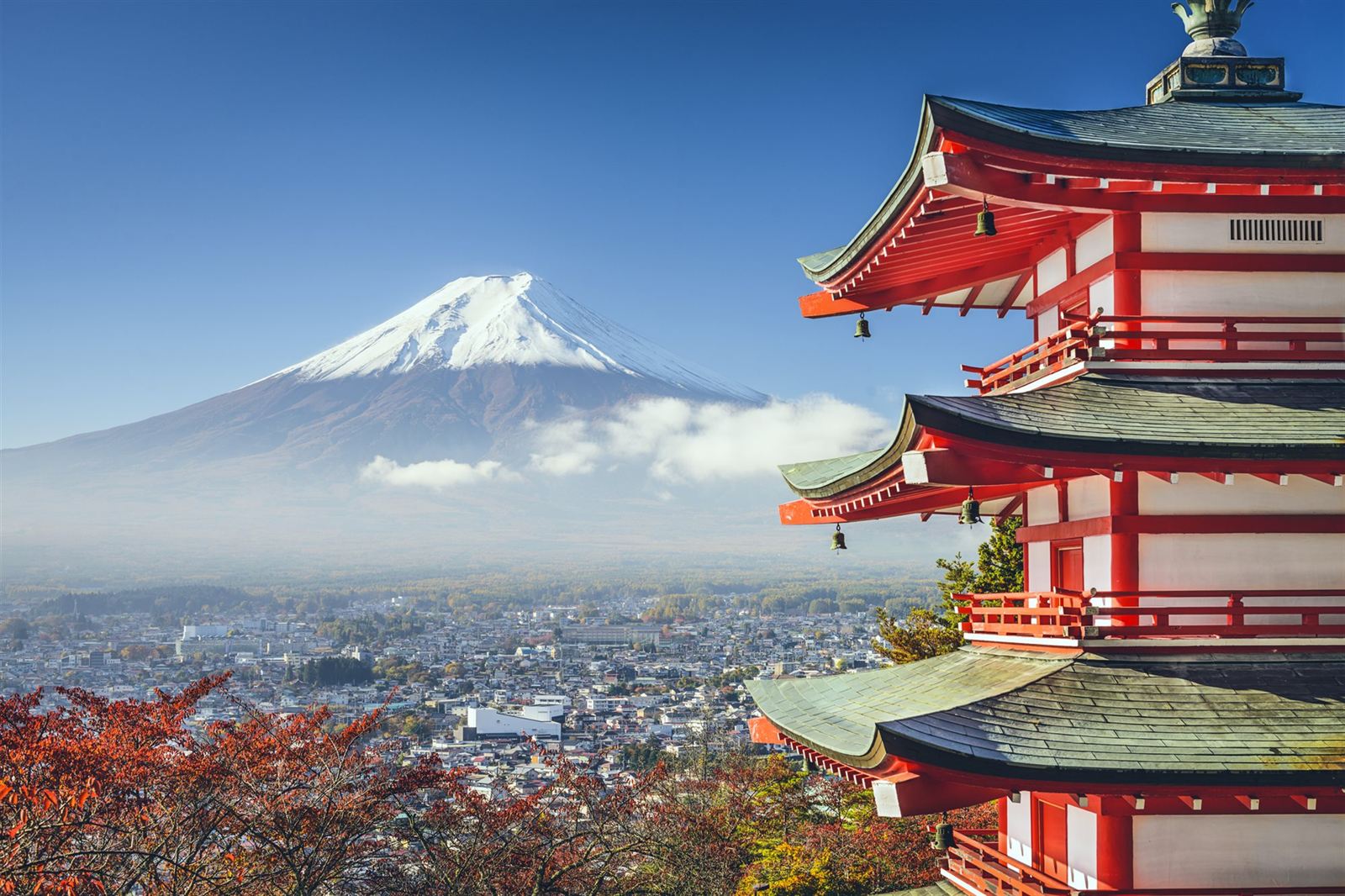 Chureito Pagoda in autumn with snow-capped Mount Fuji above Fujiyoshida town, Japan