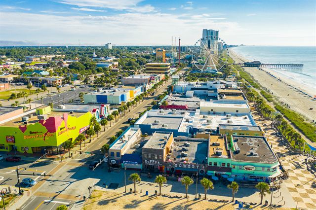 Aerial view of Myrtle Beach oceanfront attractions, hotels and the long sandy beach along the Atlantic