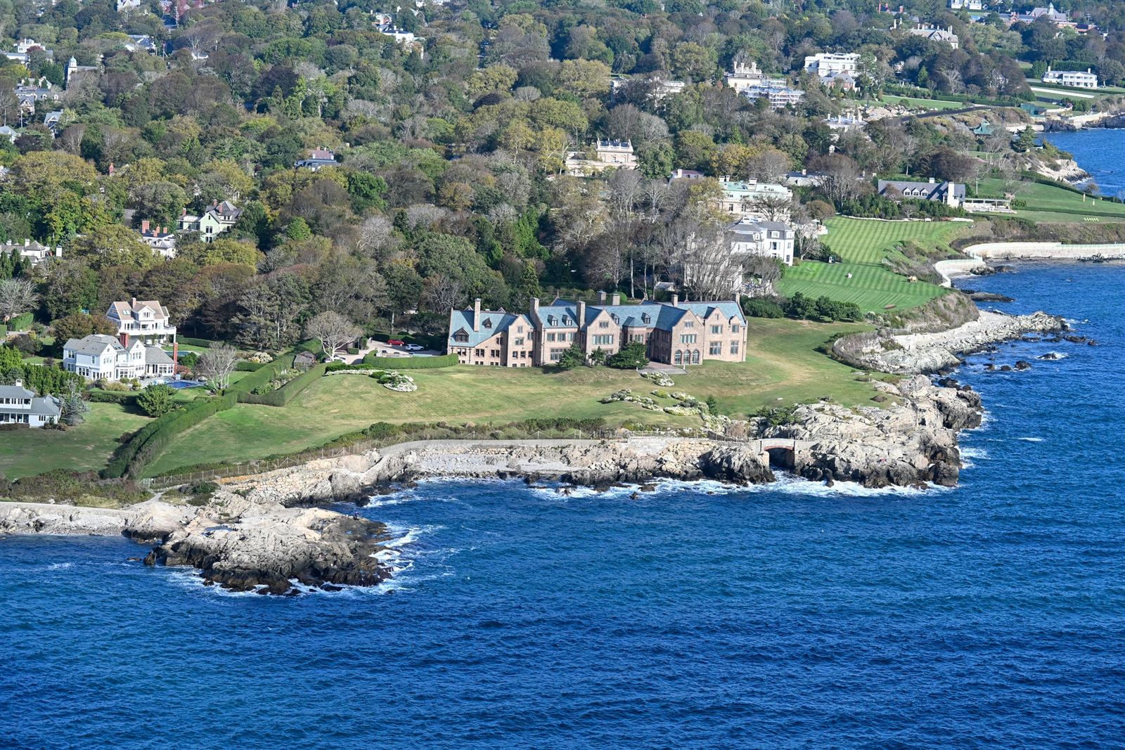 Aerial view of Gilded Age mansions and lawns on the rocky Atlantic shoreline of Newport, Rhode Island