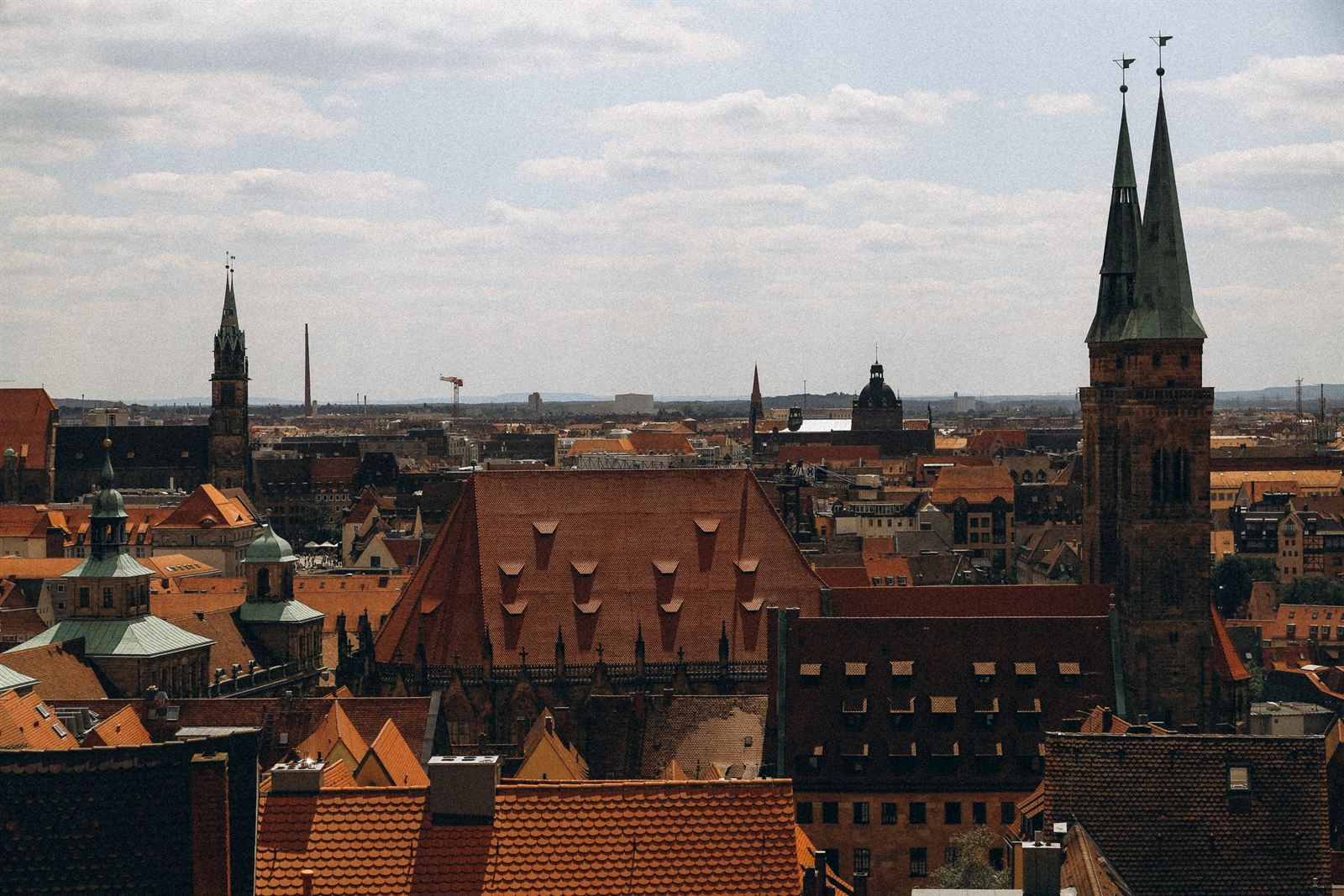 Red-tiled rooftops of Nuremberg old town with the twin spires of a Gothic church
