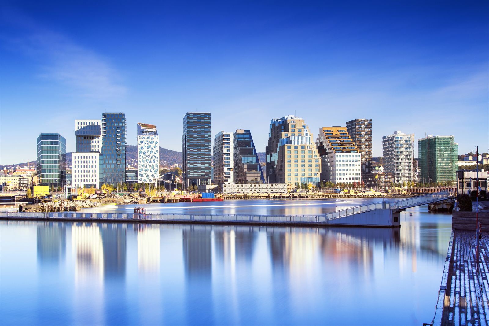 Modern Barcode office towers of Bjørvika reflected in the Oslofjord inlet, Oslo, Norway