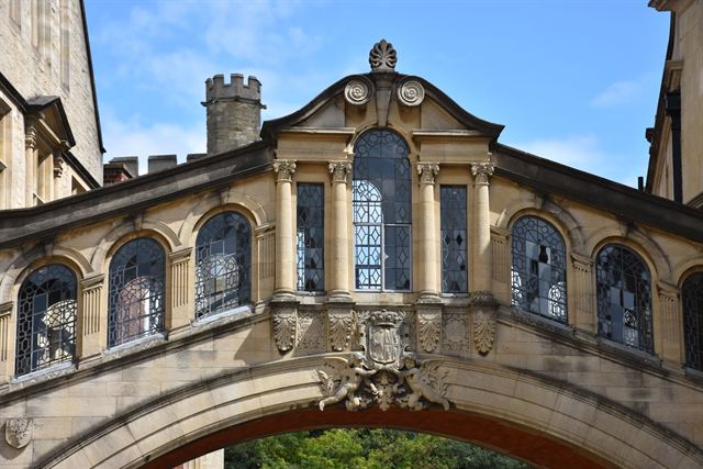 Hertford Bridge, Oxford's Bridge of Sighs, arching over New College Lane against blue sky