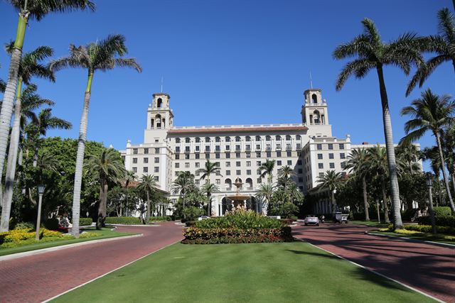 Palm-lined entrance drive leading to The Breakers in Palm Beach