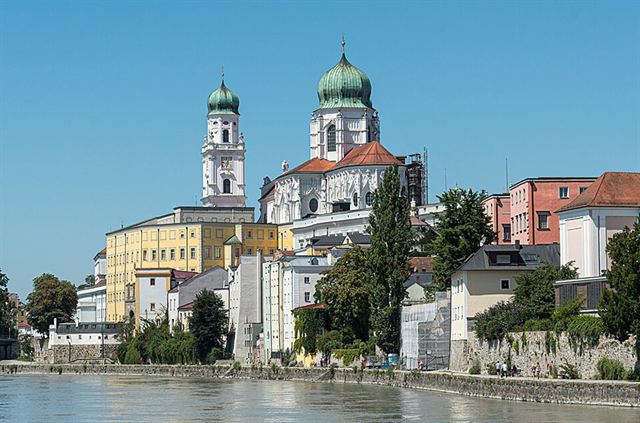 Passau riverfront with the green-domed St Stephen Cathedral towers above the Inn River