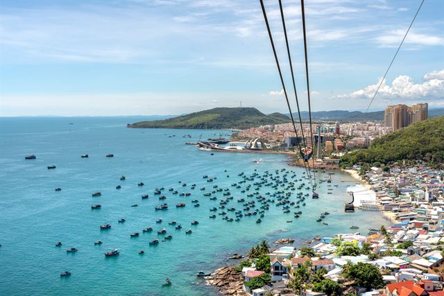 View from the Hon Thom cable car over turquoise water full of fishing boats off An Thoi, Phu Quoc