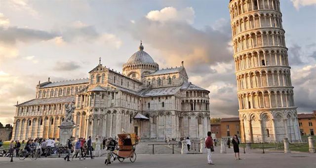 Visitors in the Piazza dei Miracoli before Pisa Cathedral and the Leaning Tower