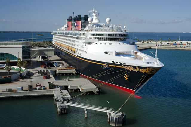 The Disney Magic cruise ship docked at a cruise terminal