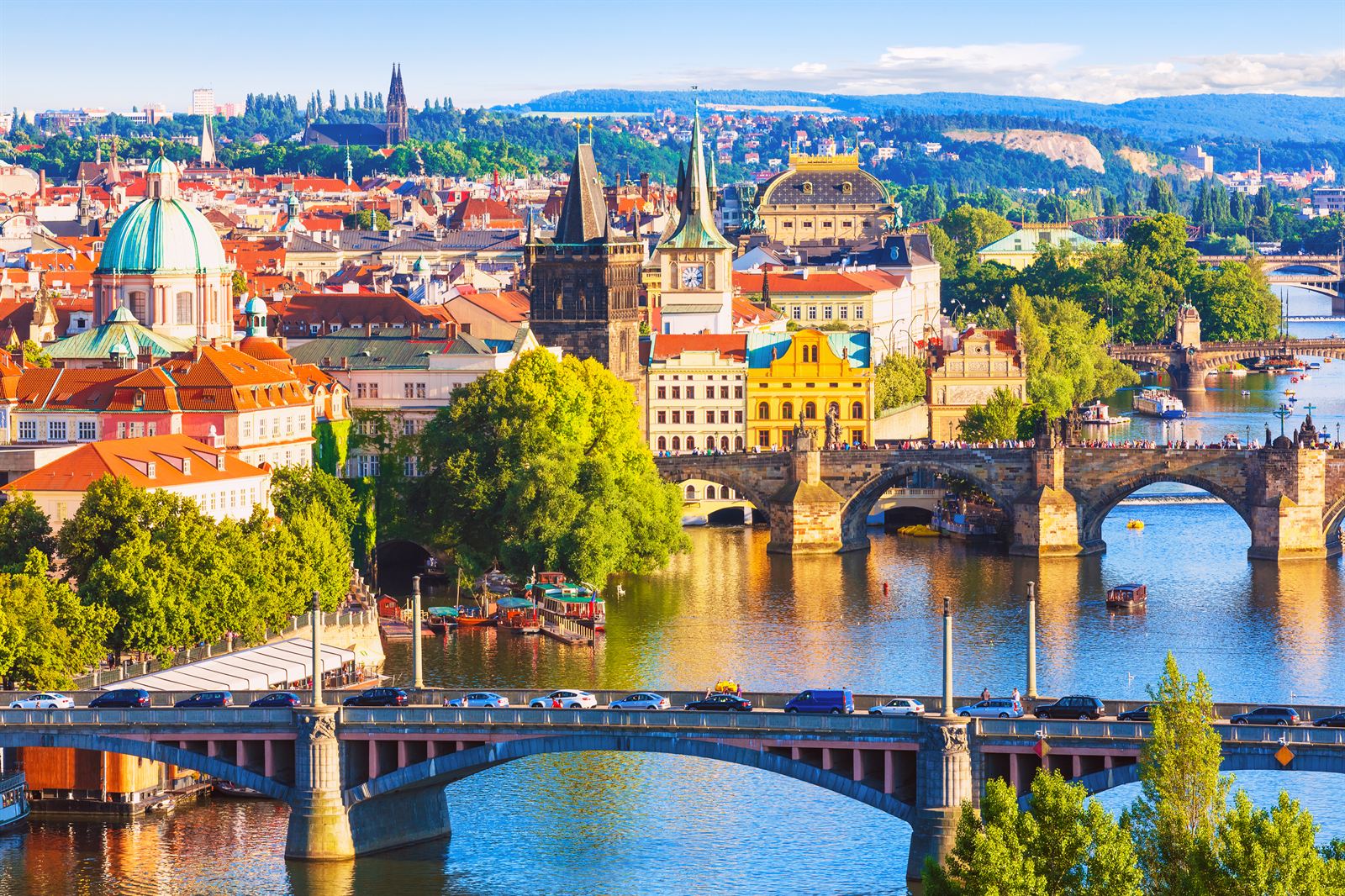 Aerial view of Prague's Old Town, church domes and the Charles Bridge over the Vltava river