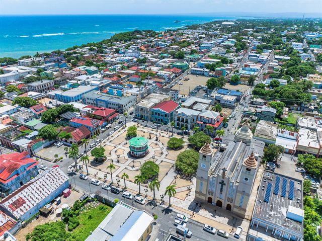 Aerial view of central Puerto Plata with its cathedral, Central Park gazebo and grid of colorful buildings