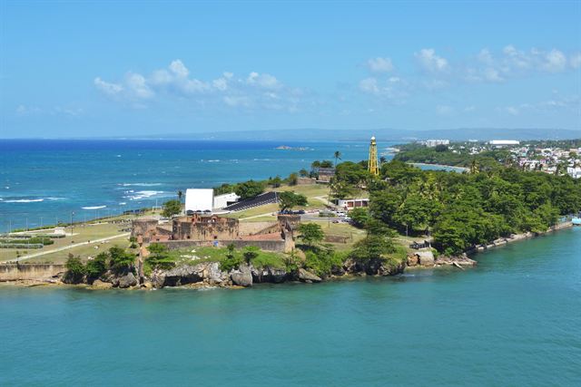Aerial view of the Fortaleza San Felipe on a green headland at the Puerto Plata harbor entrance