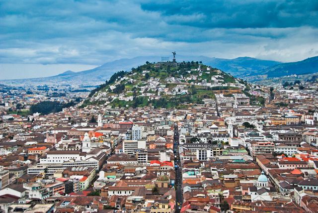 Aerial view of Quito’s historic center with El Panecillo hill and the Andes behind