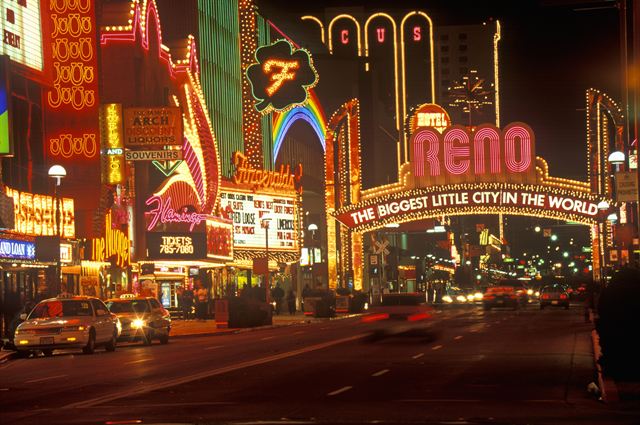 Neon casino signs and the Reno Arch on Virginia Street at night