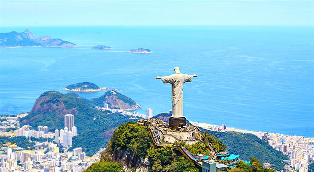 Aerial of the Christ the Redeemer statue on Corcovado with Rio's lagoon, beaches and ocean below