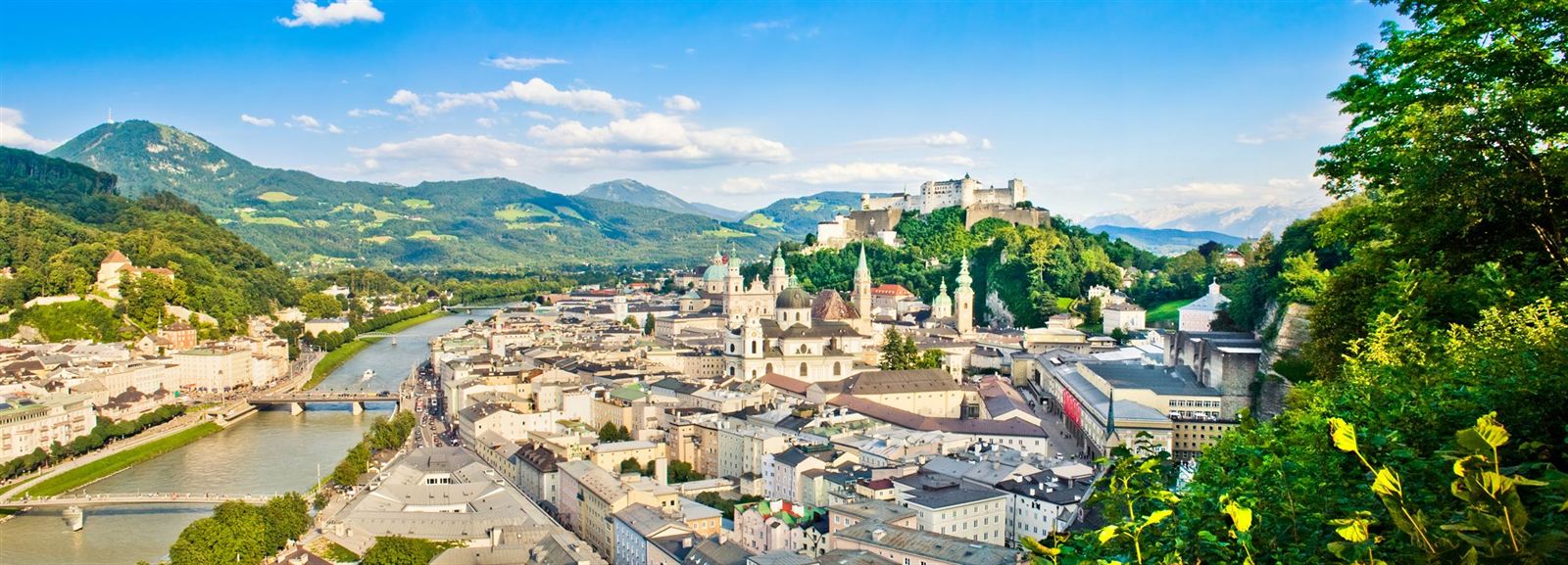 Panorama of Salzburg old town along the Salzach River with Hohensalzburg Fortress on the hill