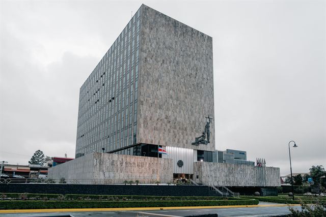 Modernist stone tower of Costa Rica's Supreme Court of Justice building in San Jose on an overcast day
