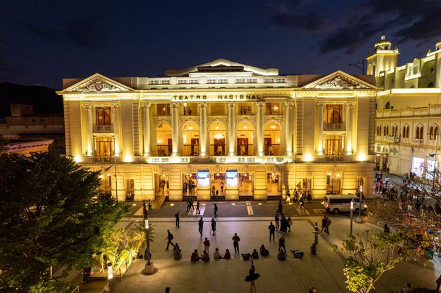 Teatro Nacional de El Salvador illuminated at night on its plaza in downtown San Salvador