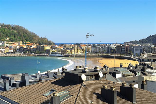 San Sebastian rooftops overlooking La Concha beach, the bay and surrounding hills
