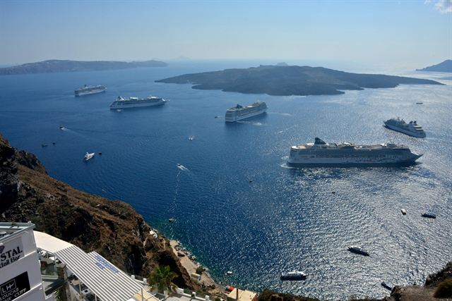 Blue-domed churches above the Aegean in Oia