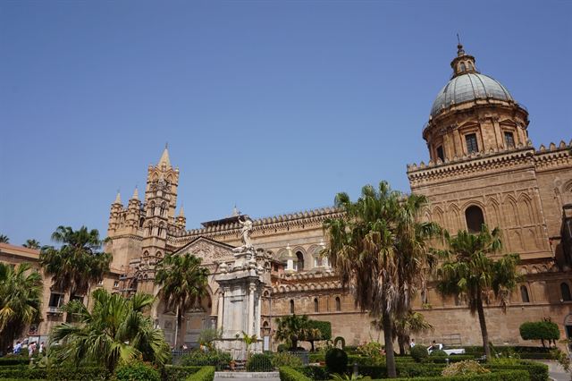Palermo, Sicily: Palermo Cathedral's Arab-Norman facade and dome framed by palm trees