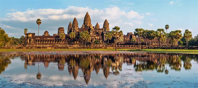 Angkor Wat temple towers reflected in the lotus pond at sunset, Siem Reap