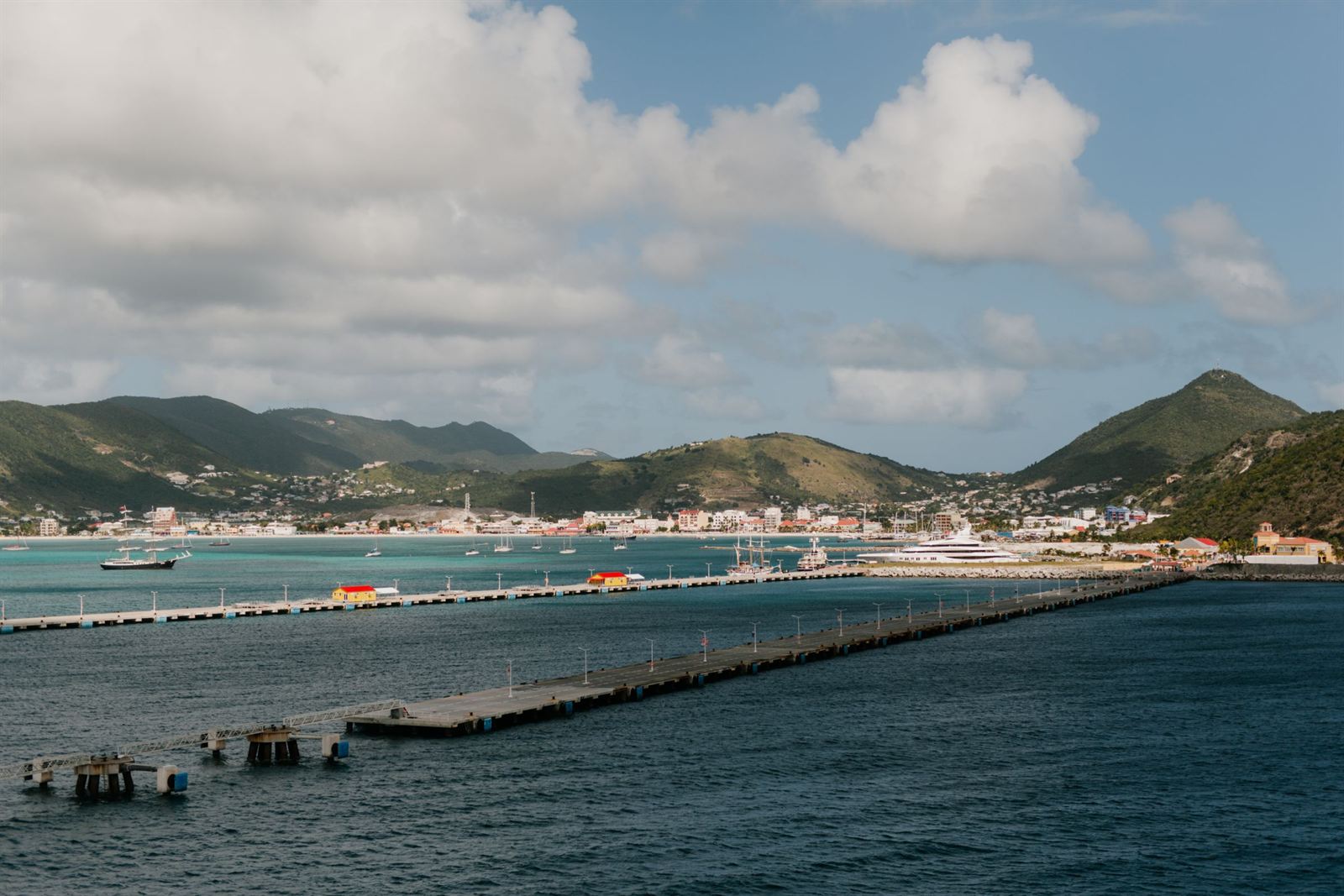 Long cruise piers stretching into Great Bay toward Philipsburg and the green hills of Sint Maarten