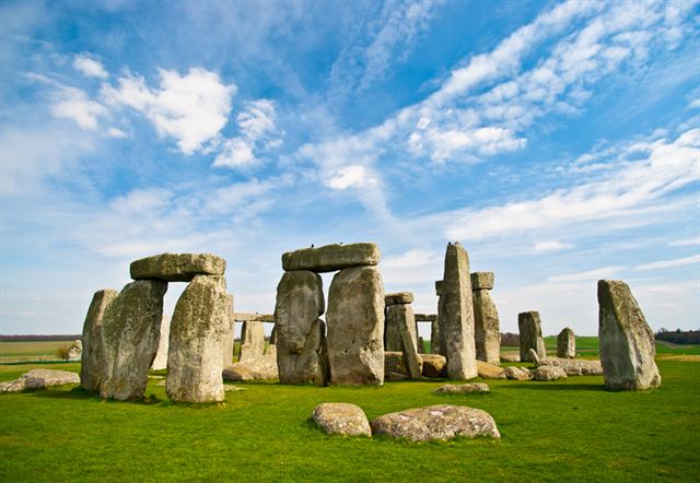 Stonehenge prehistoric stone circle on Salisbury Plain with scattered fallen stones on the grass