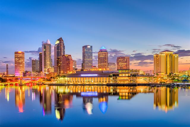 Downtown Tampa skyline lit up at twilight and reflected in the Hillsborough River, Florida