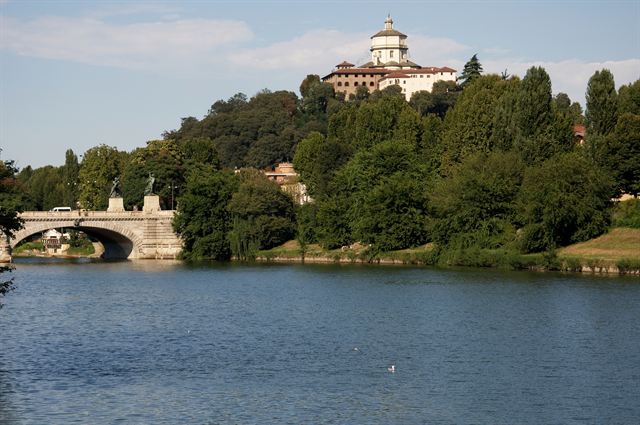Po River in Turin with the Umberto I bridge and Monte dei Cappuccini church on the hill