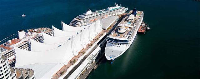 Aerial view of Canada Place cruise terminal with two cruise ships alongside