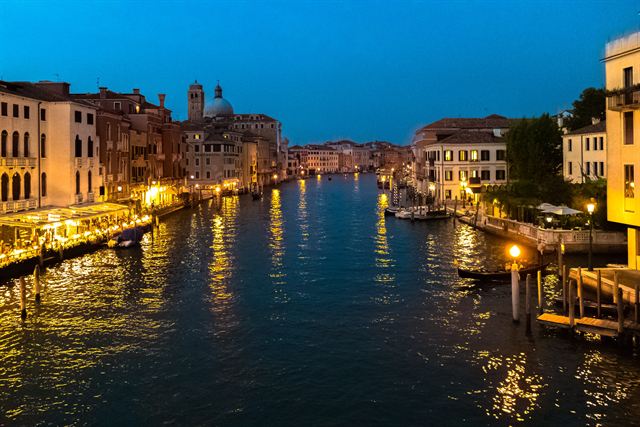 Grand Canal lined with lit palazzos at night