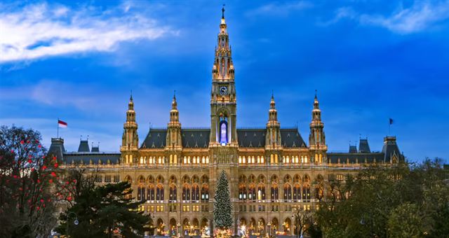 Neo-Gothic Vienna City Hall (Rathaus) with its central tower at sunset