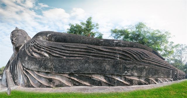 Giant reclining Buddha sculpture in Buddha Park, Vientiane