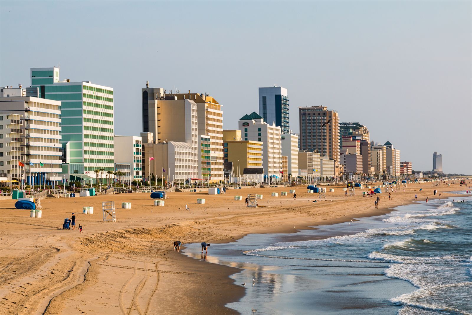 Virginia Beach oceanfront hotels lining the boardwalk and wide sandy beach