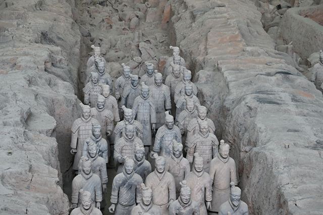 Rows of Terracotta Warriors standing in an excavated pit at the Qin mausoleum near Xi'an