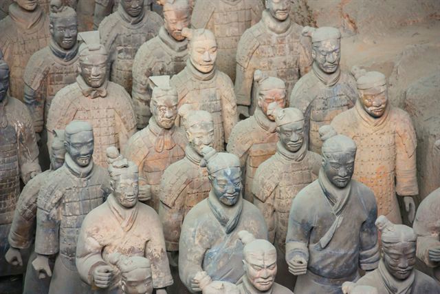 Close view of ranks of clay Terracotta Army soldiers with individual faces in Xi'an
